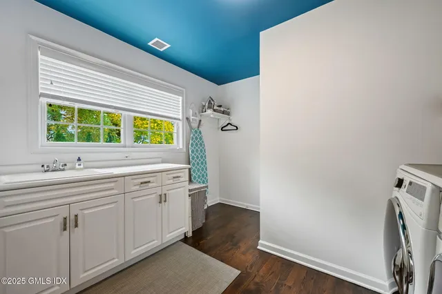 a bathroom with a sink and a window