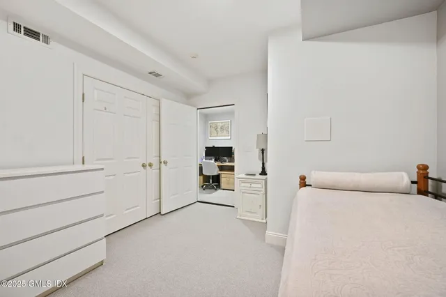 a view of a room with furniture and cabinet