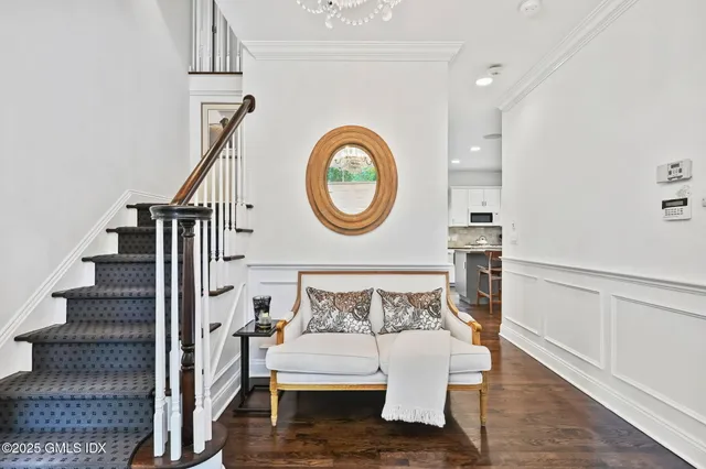 a view of entryway with wooden floor and window