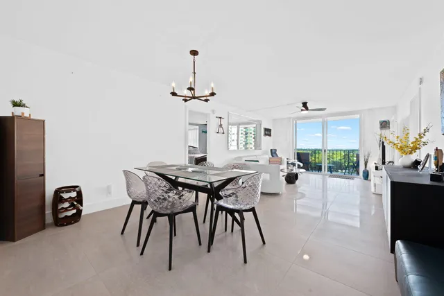 a view of a dining room with furniture and a window