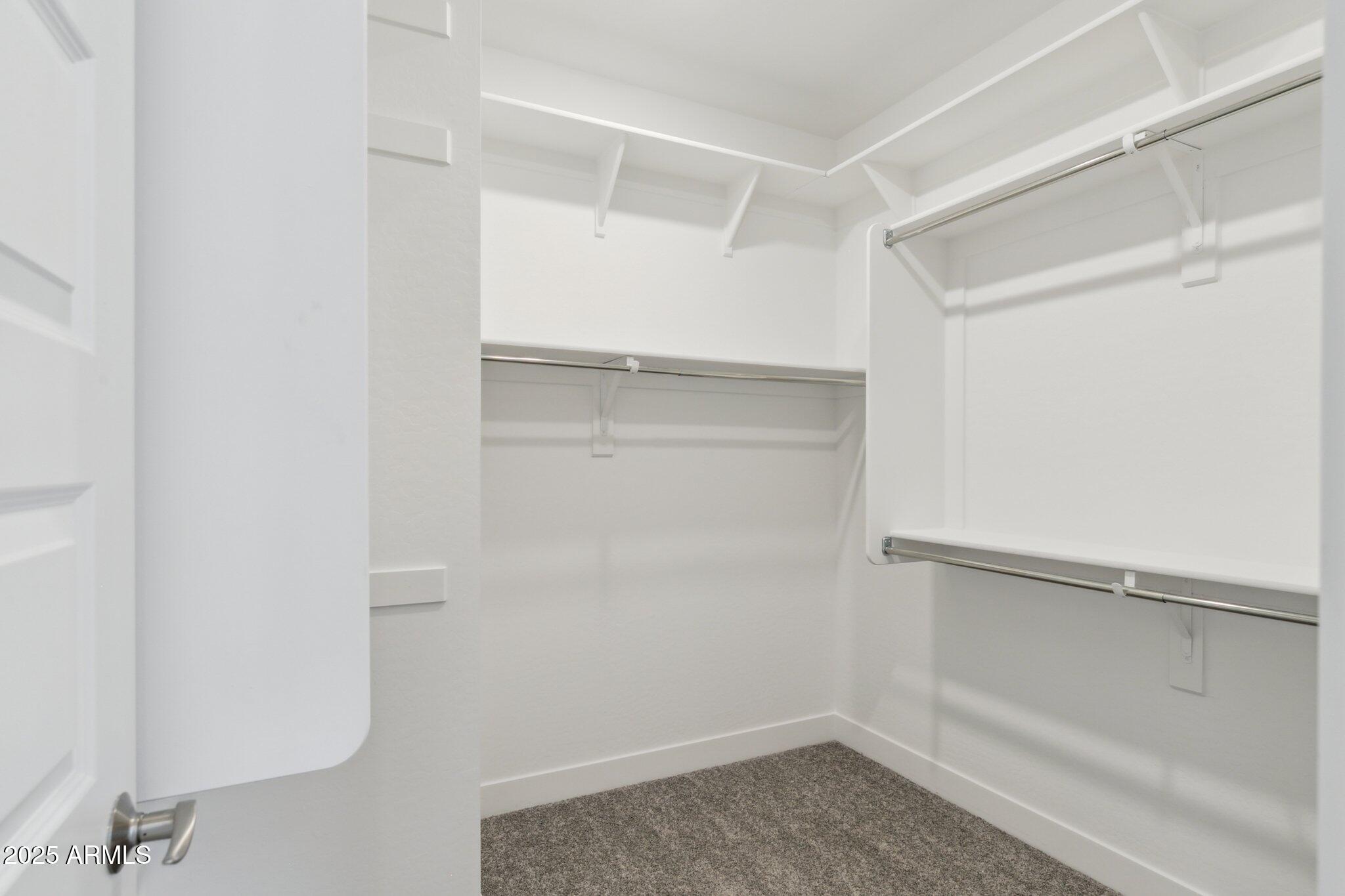 14742 West Soft Wind Drive Surprise, AZ 85387 - Photo 19 of 26 a view of an empty walk in closet