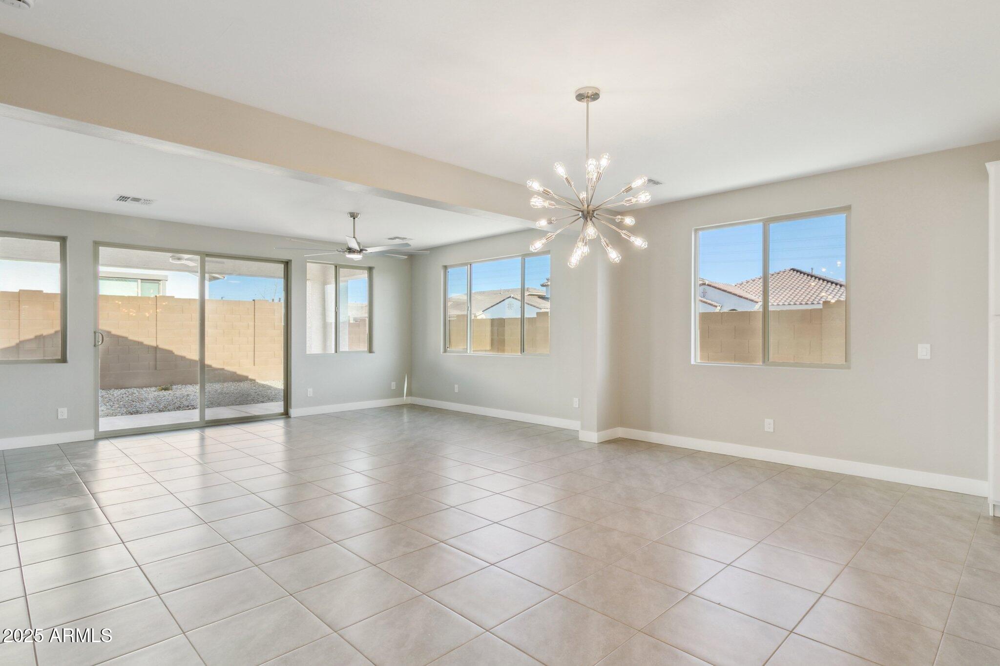 14742 West Soft Wind Drive Surprise, AZ 85387 - Photo 20 of 26 a view of an empty room with a window