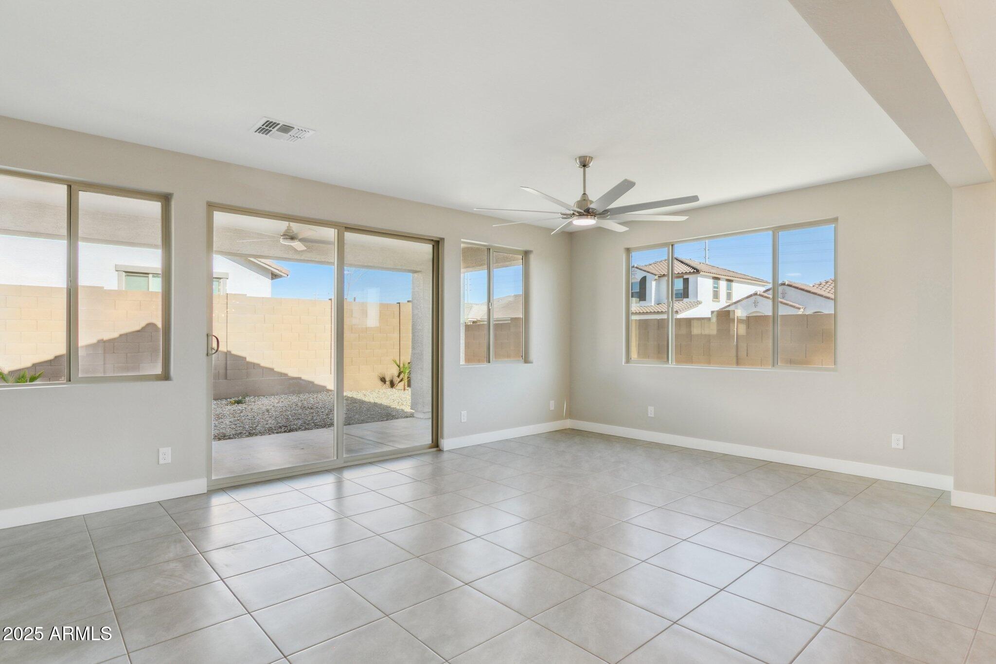14742 West Soft Wind Drive Surprise, AZ 85387 - Photo 21 of 26 a view of an empty room with a window