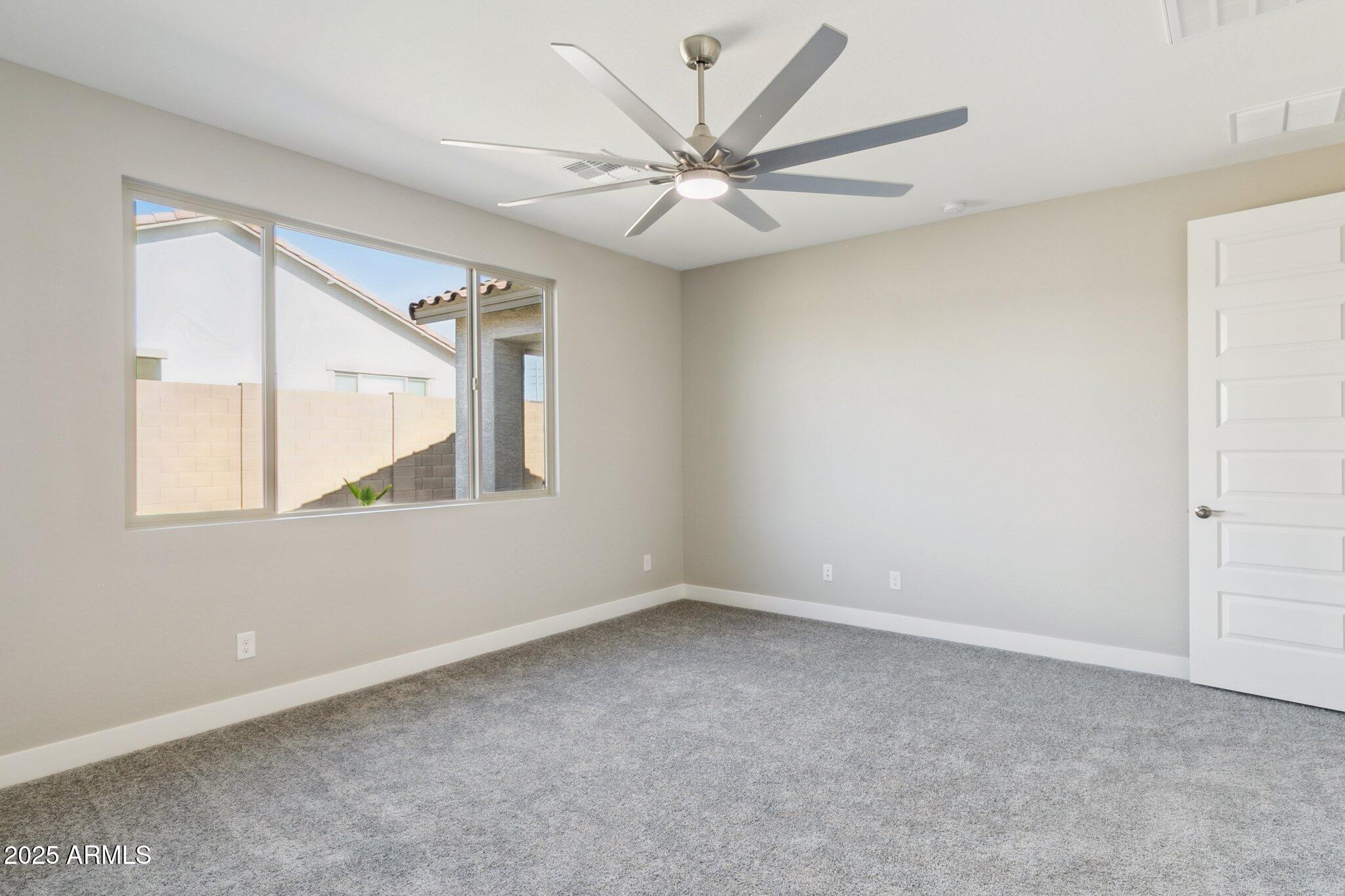 14742 West Soft Wind Drive Surprise, AZ 85387 - Photo 23 of 26 a view of an empty room with a window