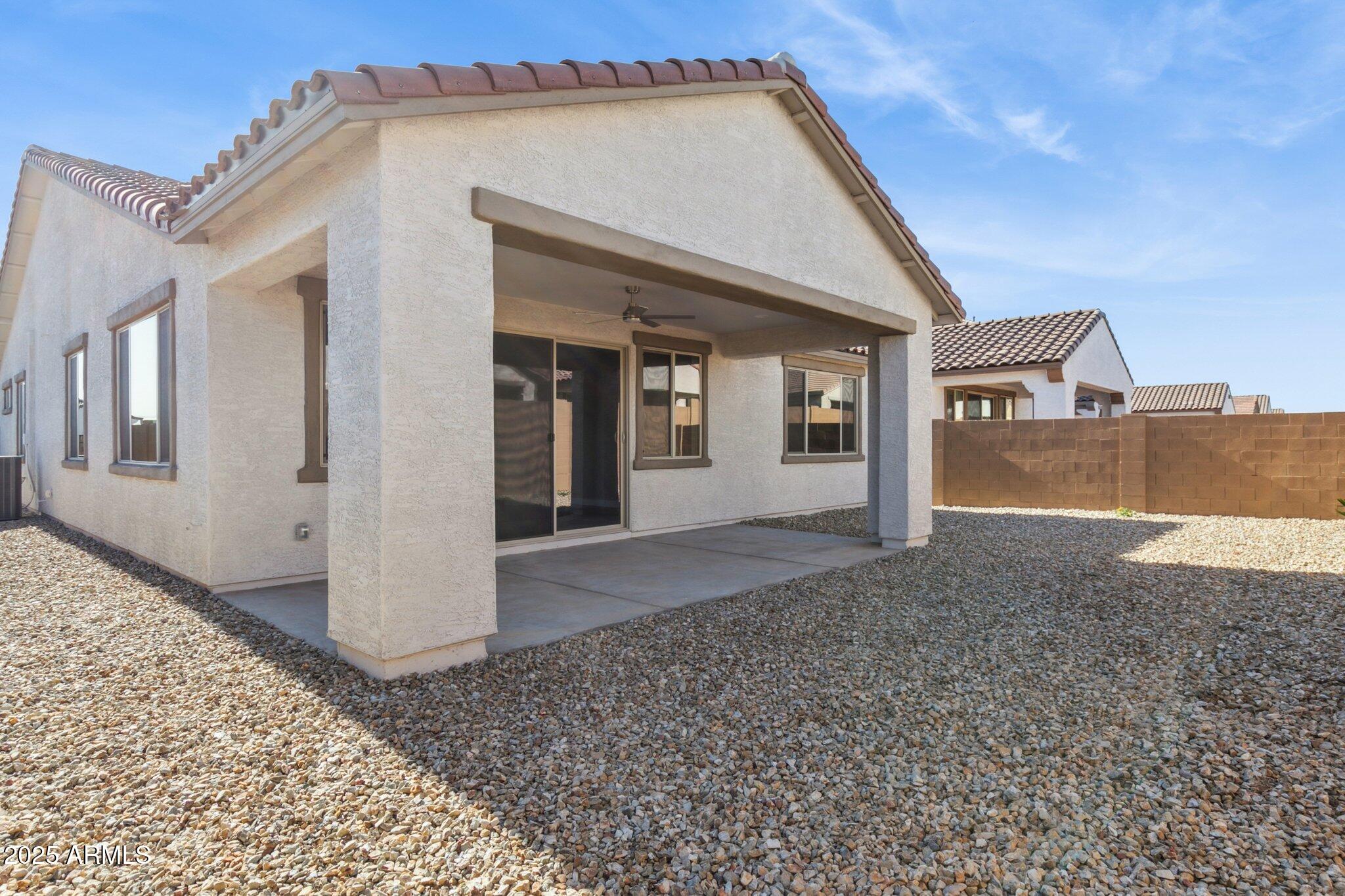 14742 West Soft Wind Drive Surprise, AZ 85387 - Photo 3 of 26 a view of a house with a backyard