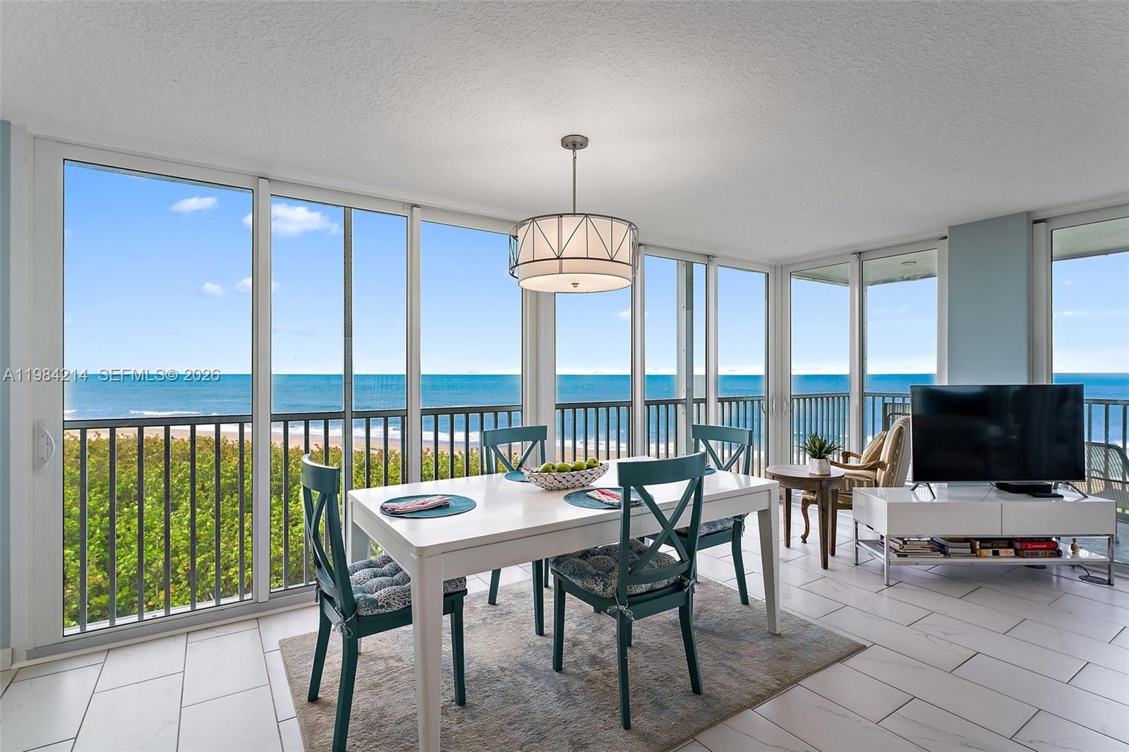 669 Northeast Plantation Road, Unit 406 Stuart, FL 34996 - Photo 8 of 41 a view of a livingroom with furniture window and outside view
