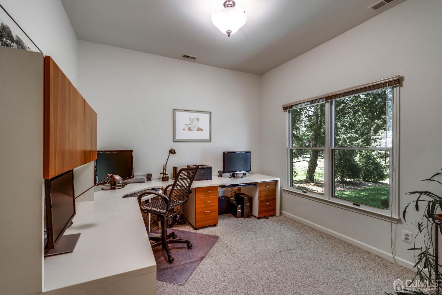9 Dickinson Road Kendall Park, NJ 08824 - Photo 12 of 34 a view of a workspace with furniture and a window