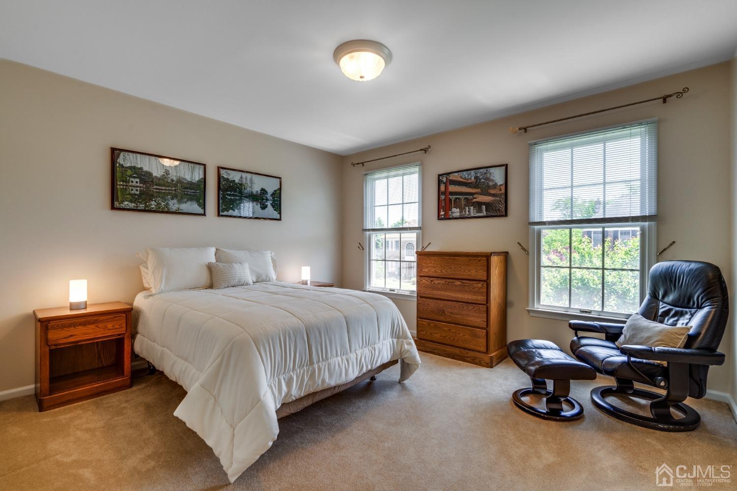 9 Dickinson Road Kendall Park, NJ 08824 - Photo 15 of 34 a bedroom with a bed and a window