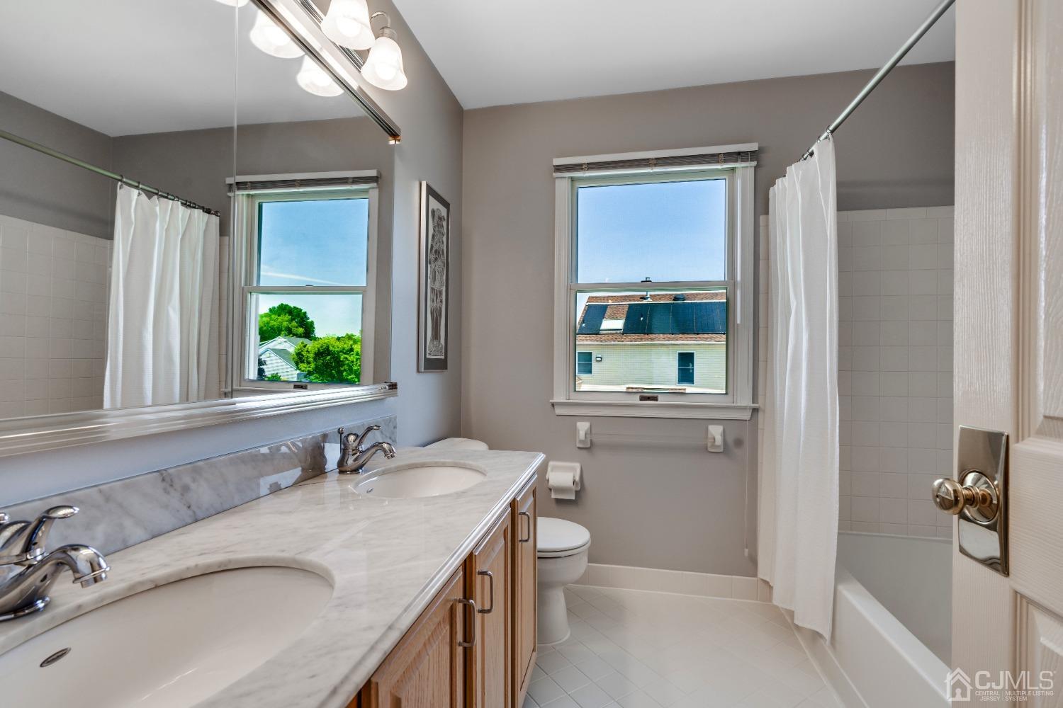 9 Dickinson Road Kendall Park, NJ 08824 - Photo 18 of 34 a bathroom with a granite countertop sink toilet and shower