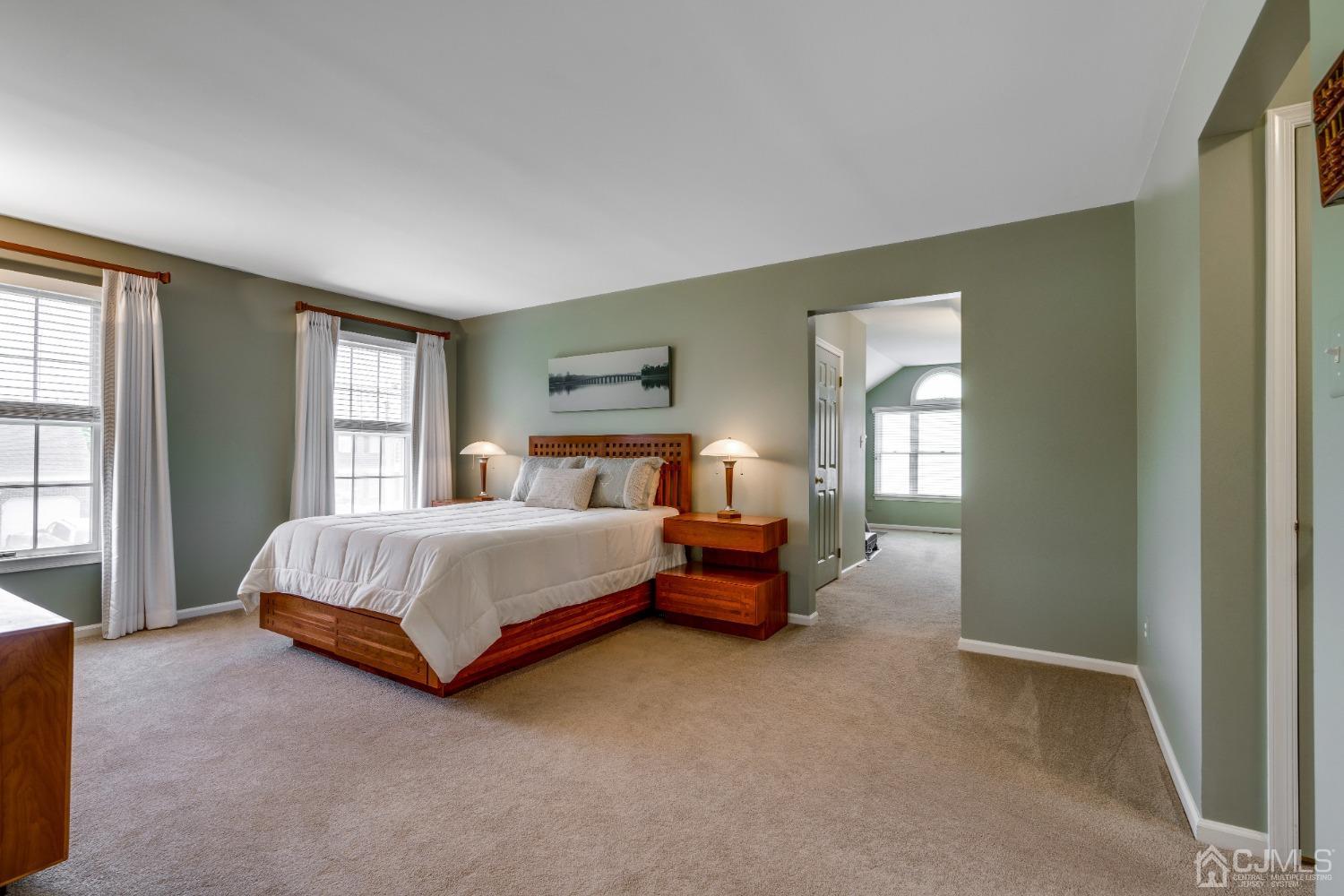 9 Dickinson Road Kendall Park, NJ 08824 - Photo 19 of 34 a spacious bedroom with a bed and window