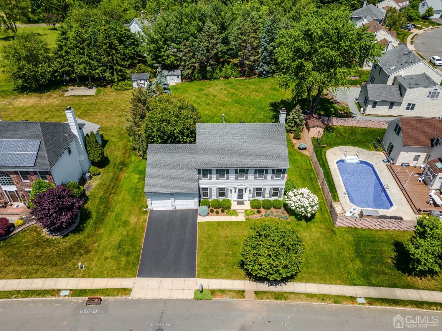9 Dickinson Road Kendall Park, NJ 08824 - Photo 28 of 34 an aerial view of a house with a garden and swimming pool
