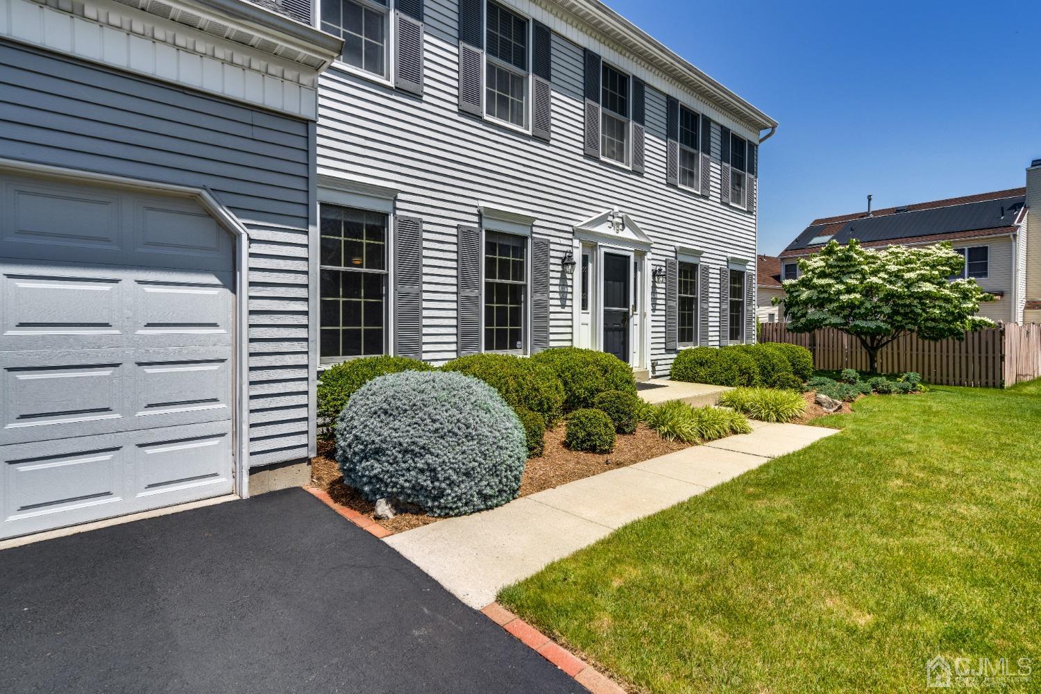 9 Dickinson Road Kendall Park, NJ 08824 - Photo 29 of 34 a front view of a house with a yard