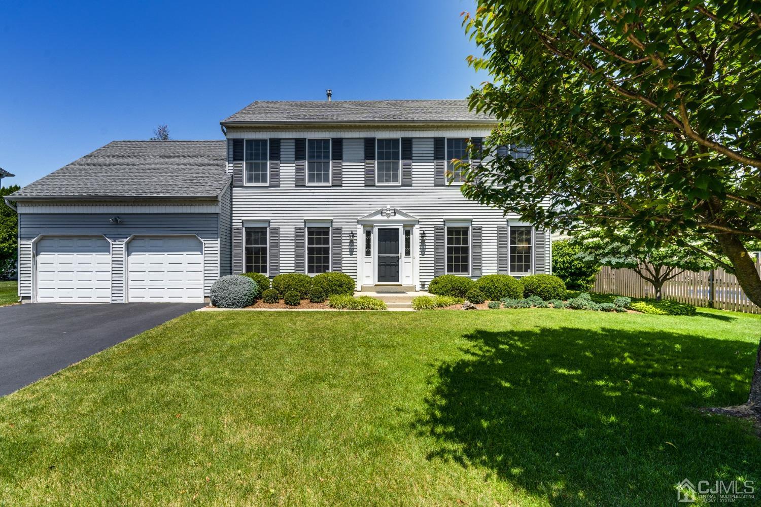 9 Dickinson Road Kendall Park, NJ 08824 - Photo 30 of 34 a front view of a house with a yard