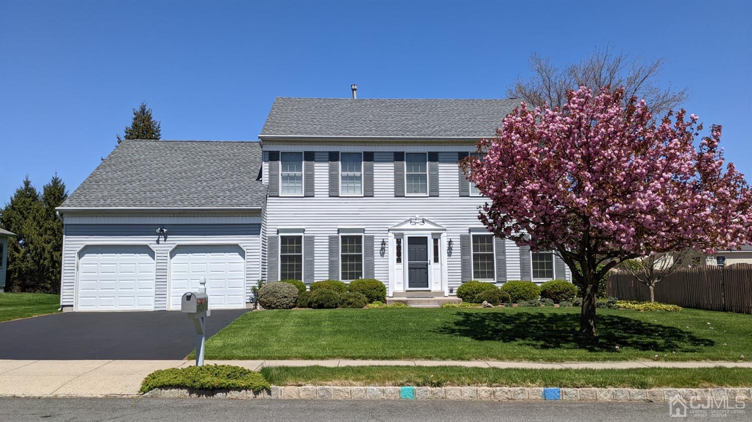 9 Dickinson Road Kendall Park, NJ 08824 - Photo 31 of 34 a front view of a house with a yard