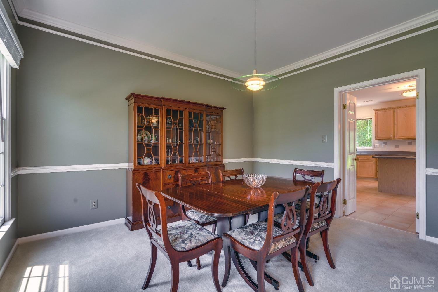 9 Dickinson Road Kendall Park, NJ 08824 - Photo 4 of 34 a dining room with furniture and window