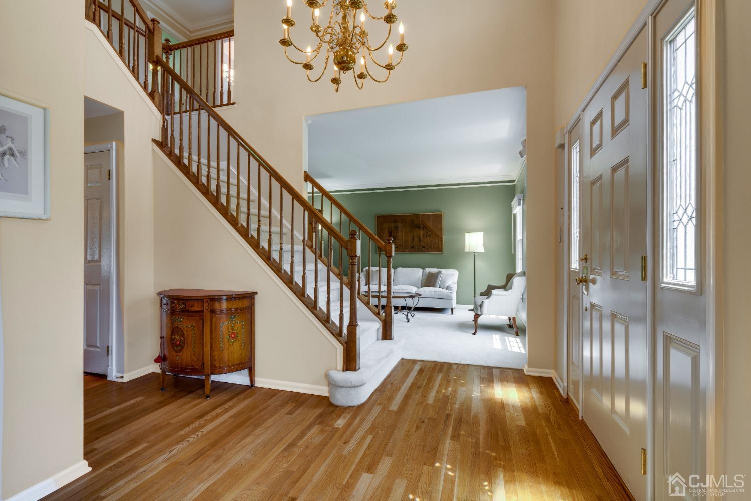 9 Dickinson Road Kendall Park, NJ 08824 - Photo 5 of 34 a view of entryway and hall with wooden floor
