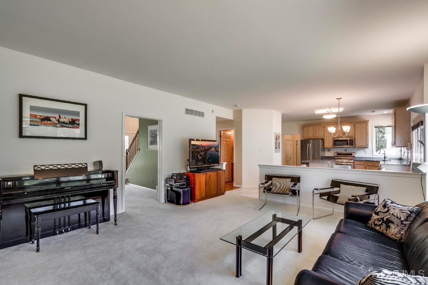 9 Dickinson Road Kendall Park, NJ 08824 - Photo 8 of 34 a living room with furniture and a flat screen tv