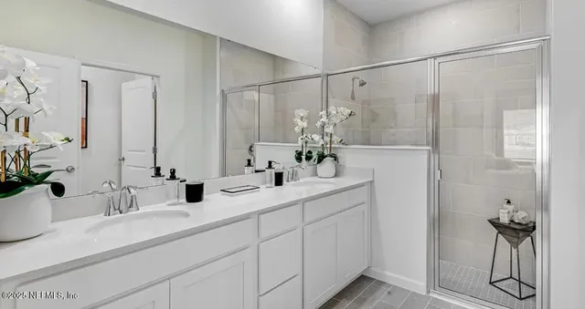a kitchen with a sink appliances and cabinets