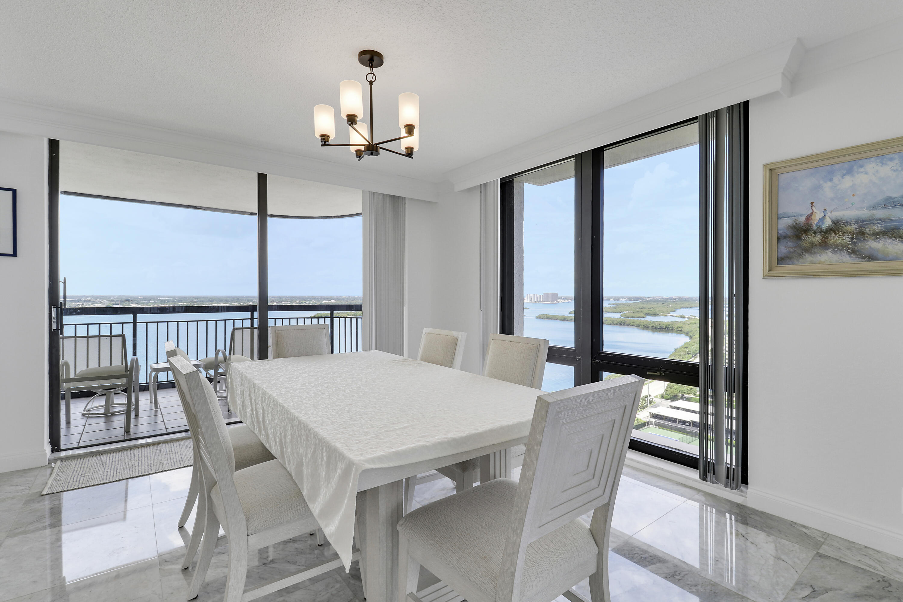 5380 North Ocean Drive, Unit 22J Riviera Beach, FL 33404 - Photo 16 of 53 a view of a dining room with furniture window and wooden floor