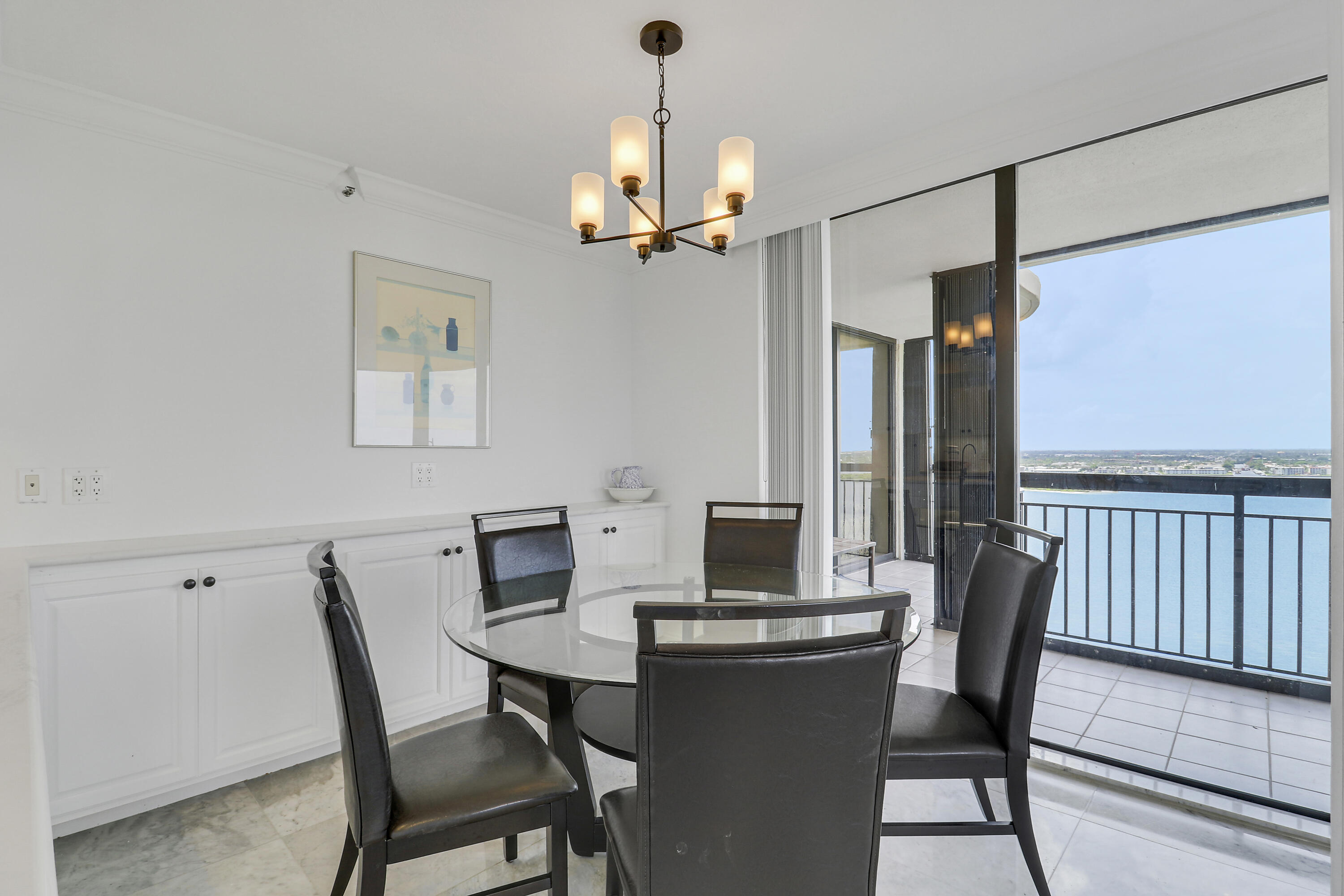 5380 North Ocean Drive, Unit 22J Riviera Beach, FL 33404 - Photo 20 of 53 a view of a dining room with furniture window and wooden floor