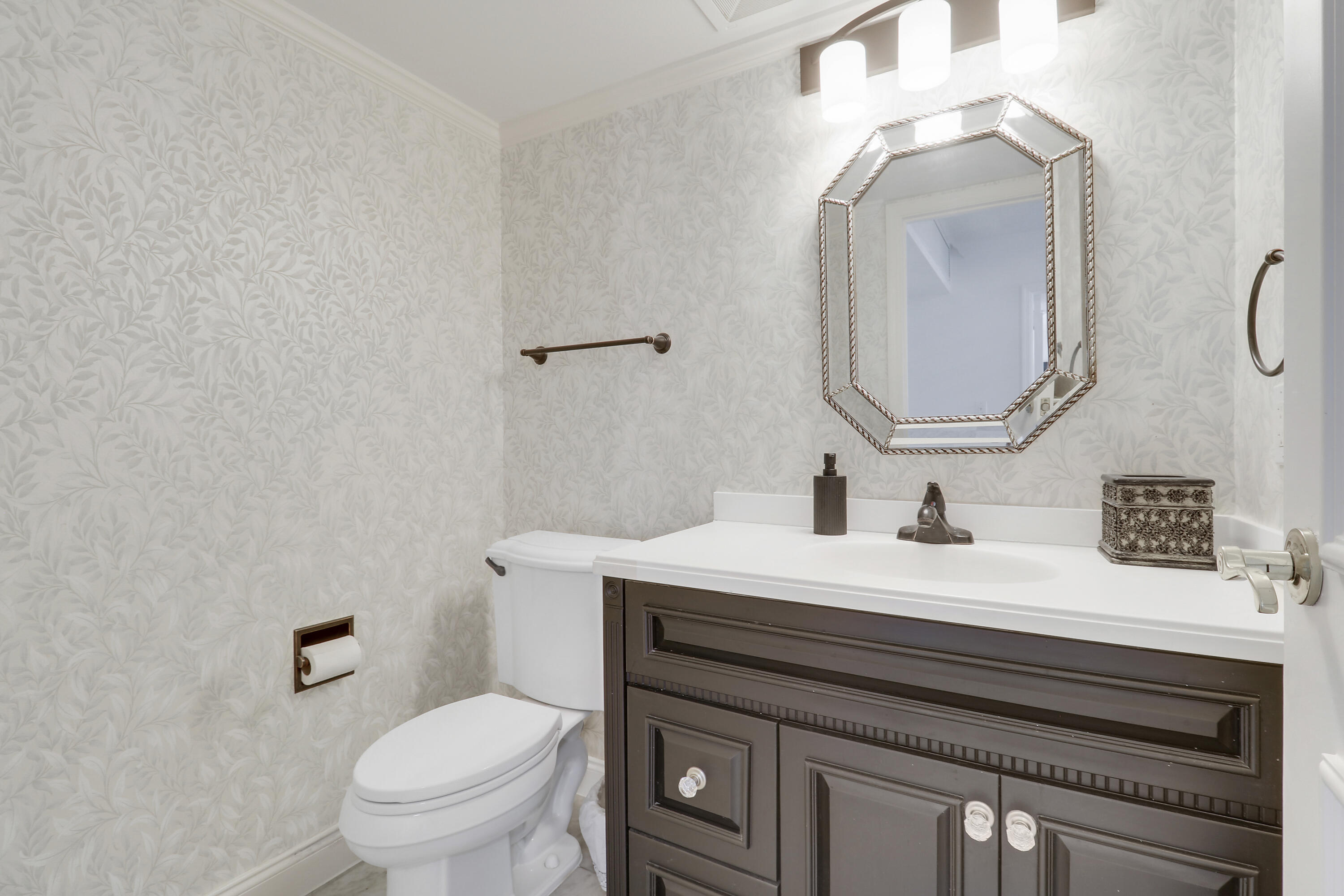 5380 North Ocean Drive, Unit 22J Riviera Beach, FL 33404 - Photo 24 of 53 a bathroom with a granite countertop toilet sink and mirror