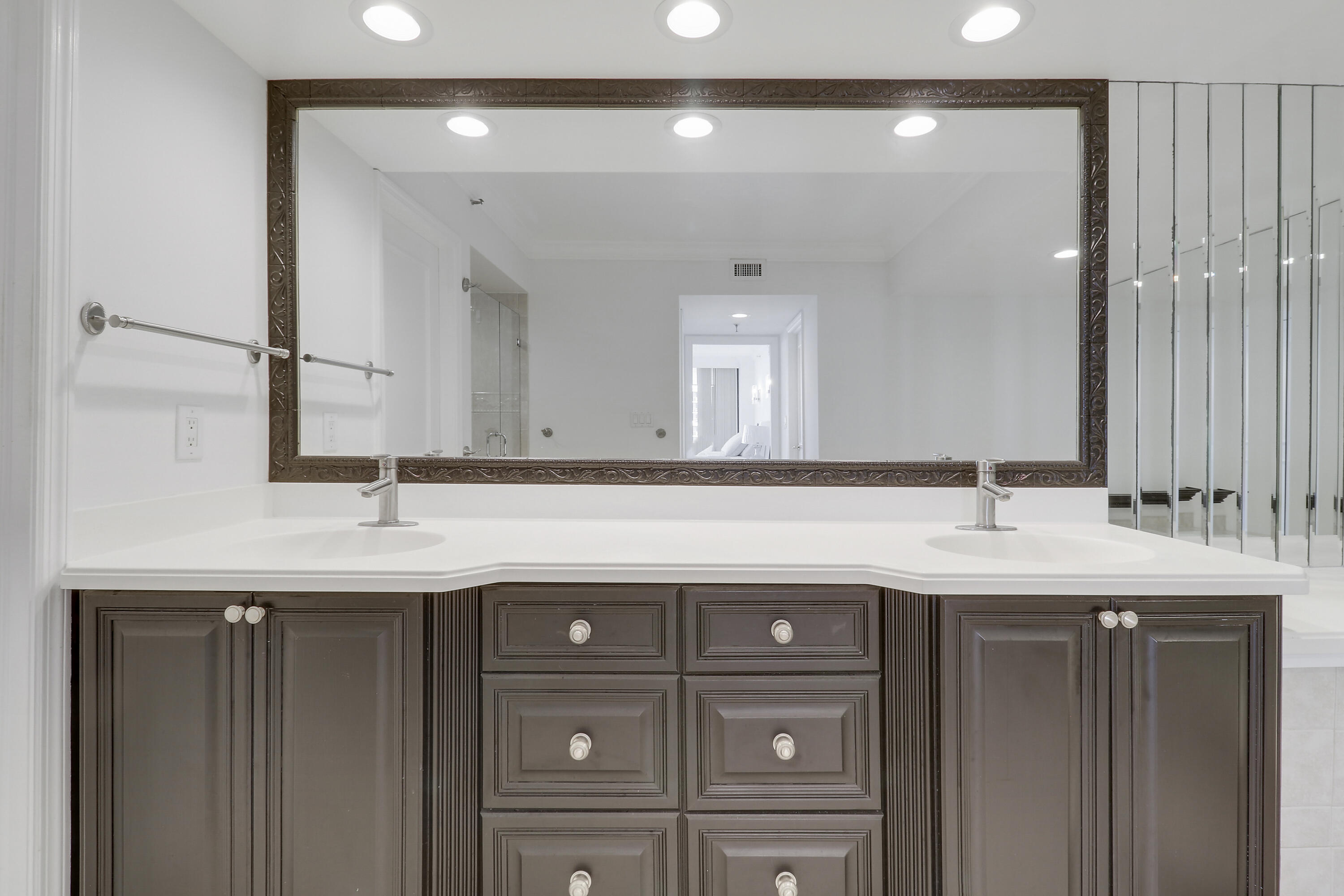 5380 North Ocean Drive, Unit 22J Riviera Beach, FL 33404 - Photo 31 of 53 a bathroom with a sink and a mirror