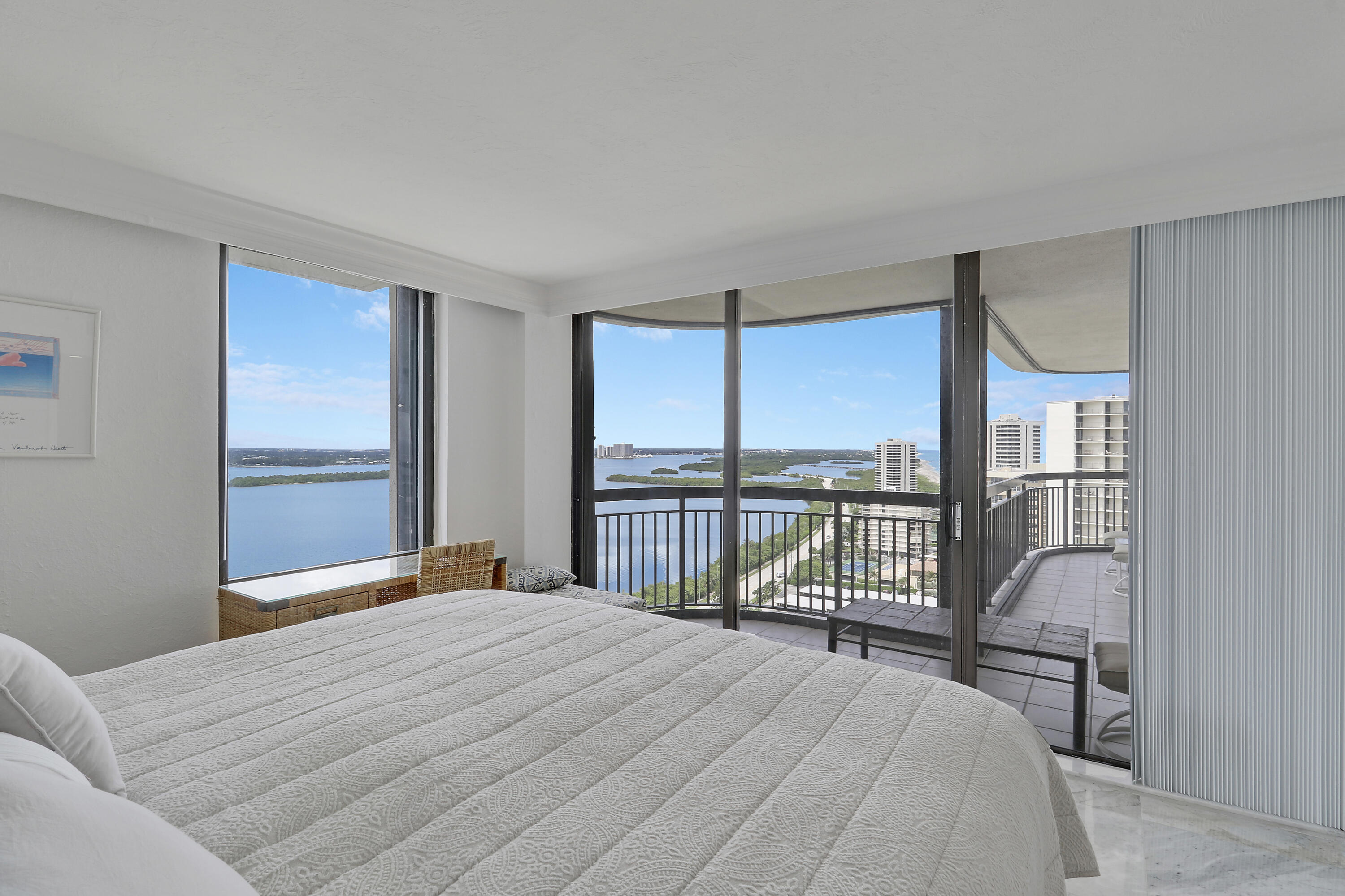 5380 North Ocean Drive, Unit 22J Riviera Beach, FL 33404 - Photo 35 of 53 a bedroom with a bed and a large window