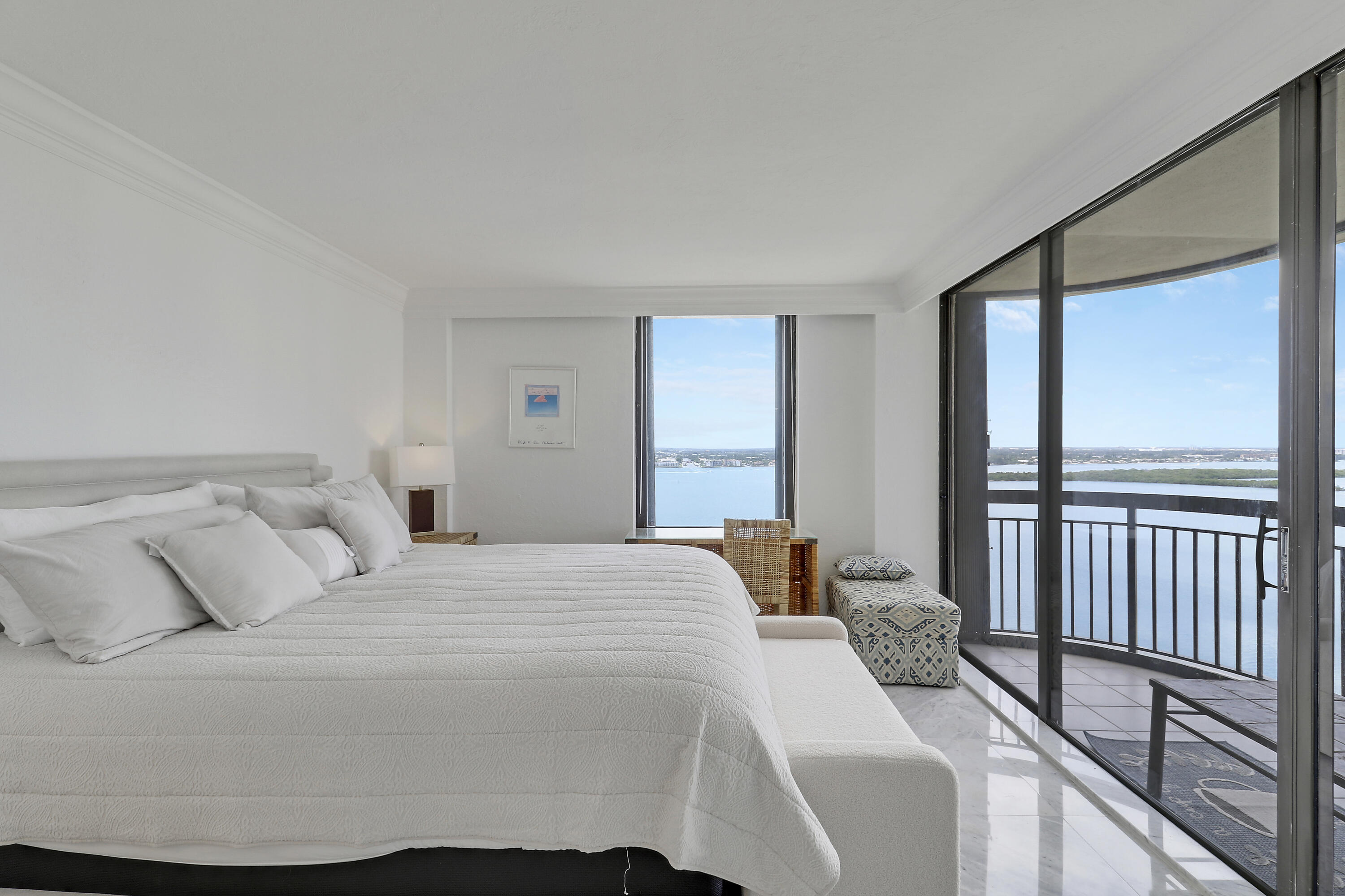 5380 North Ocean Drive, Unit 22J Riviera Beach, FL 33404 - Photo 36 of 53 a bedroom with a bed and a large window