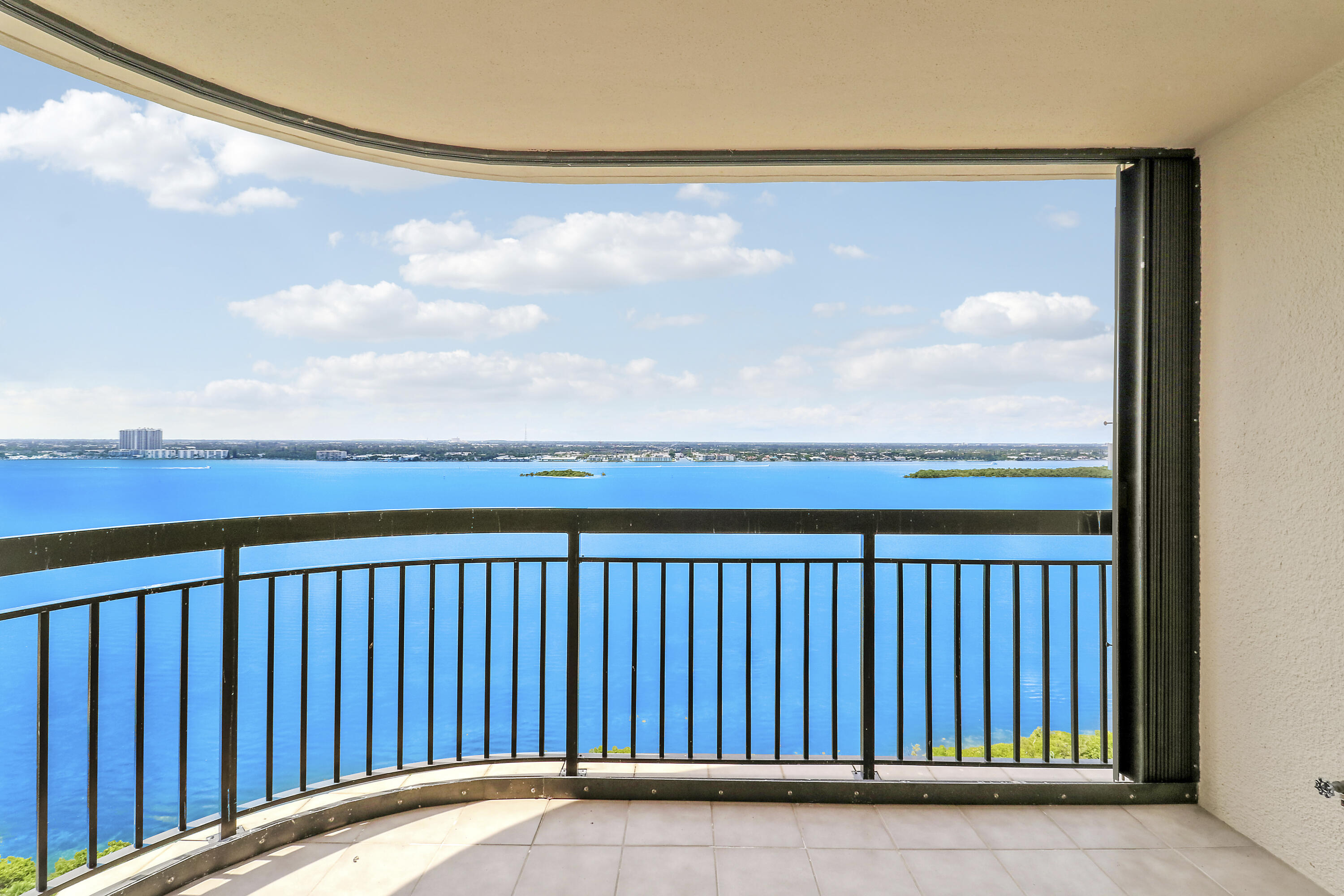 5380 North Ocean Drive, Unit 22J Riviera Beach, FL 33404 - Photo 40 of 53 a balcony with a garden