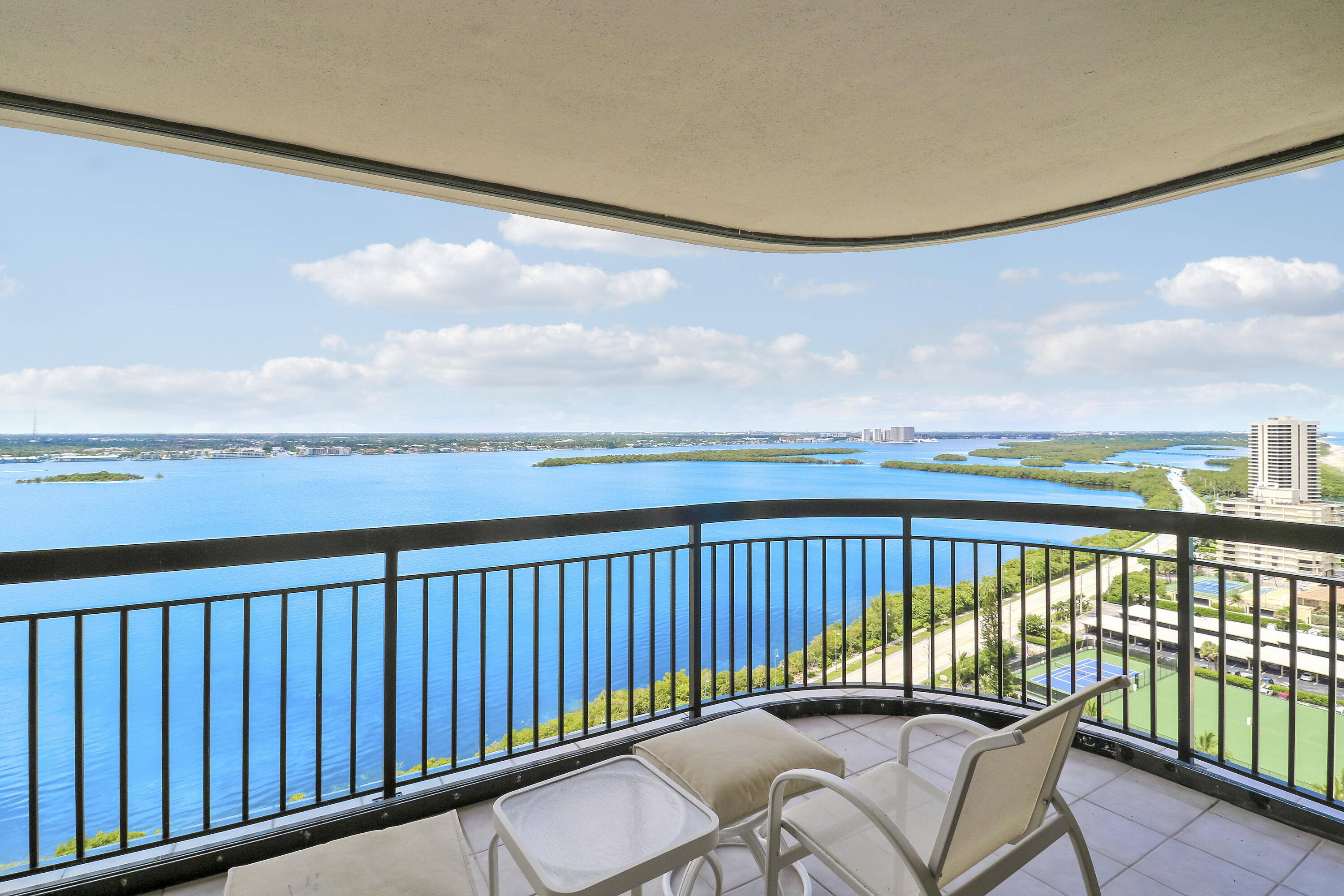 5380 North Ocean Drive, Unit 22J Riviera Beach, FL 33404 - Photo 45 of 53 a view of a balcony with furniture