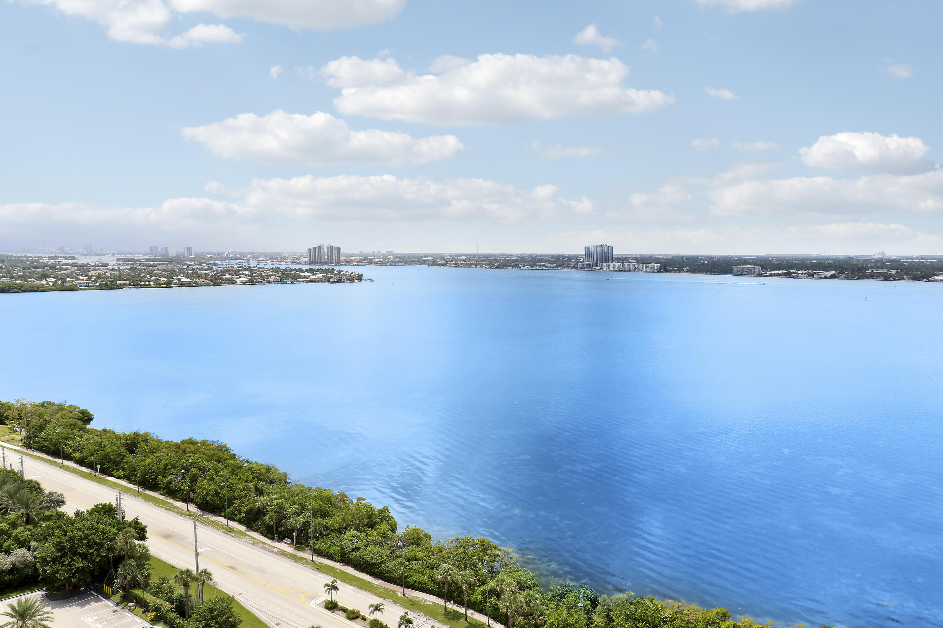 5380 North Ocean Drive, Unit 22J Riviera Beach, FL 33404 - Photo 49 of 53 a view of a lake and mountain in the back