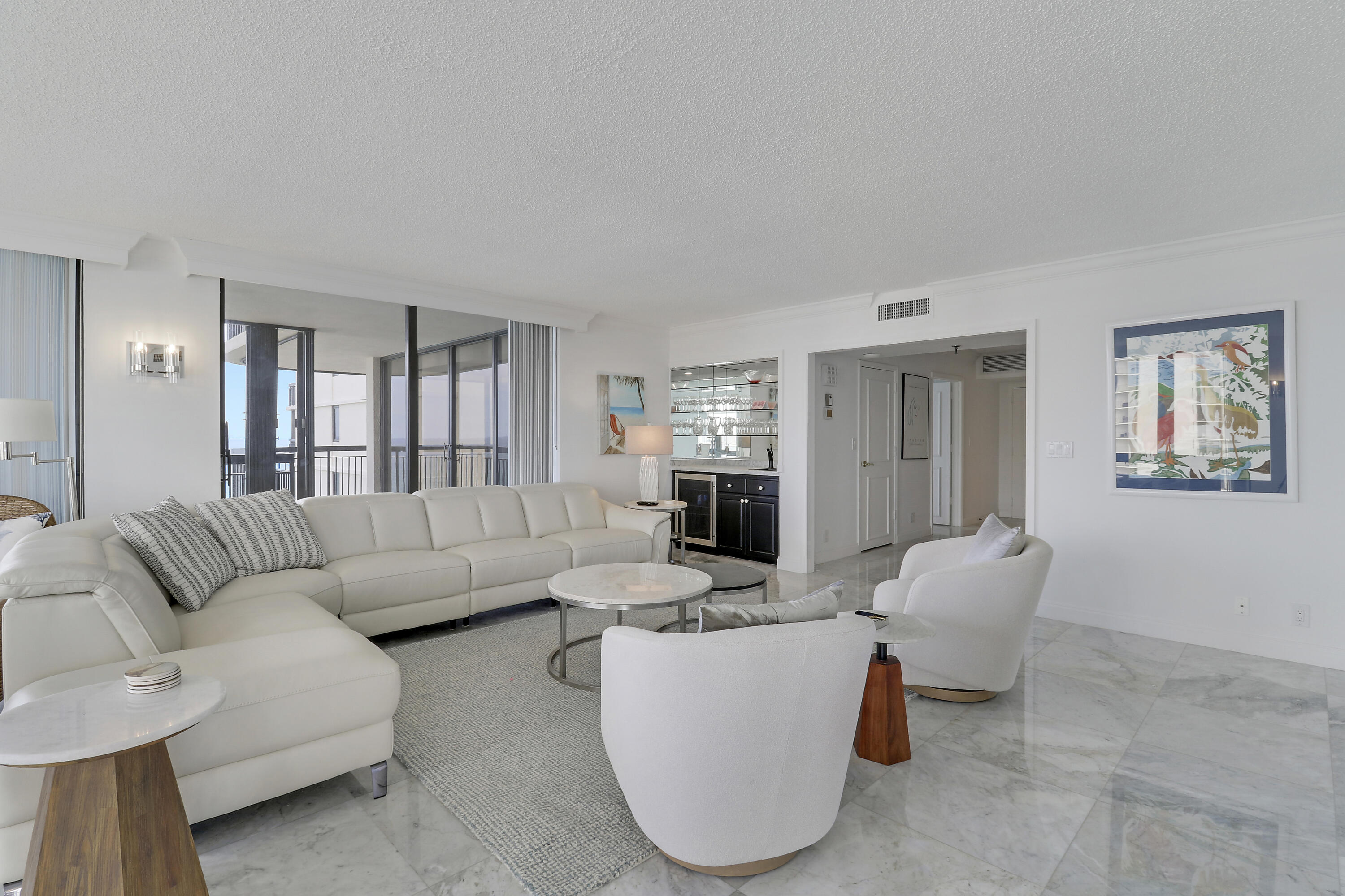 5380 North Ocean Drive, Unit 22J Riviera Beach, FL 33404 - Photo 9 of 53 a living room with furniture and a dining table