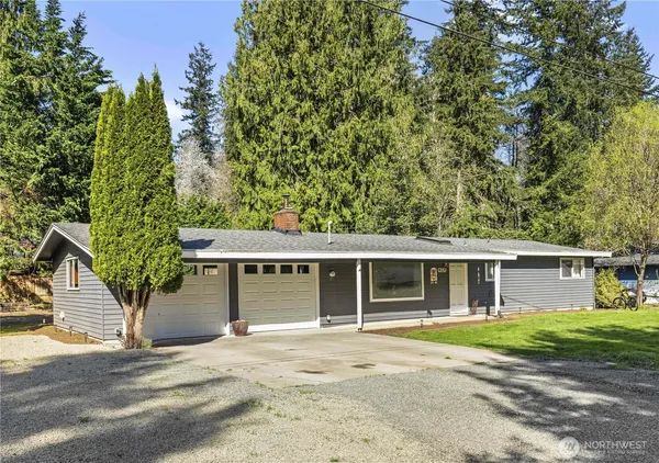 front view of a house with a tree