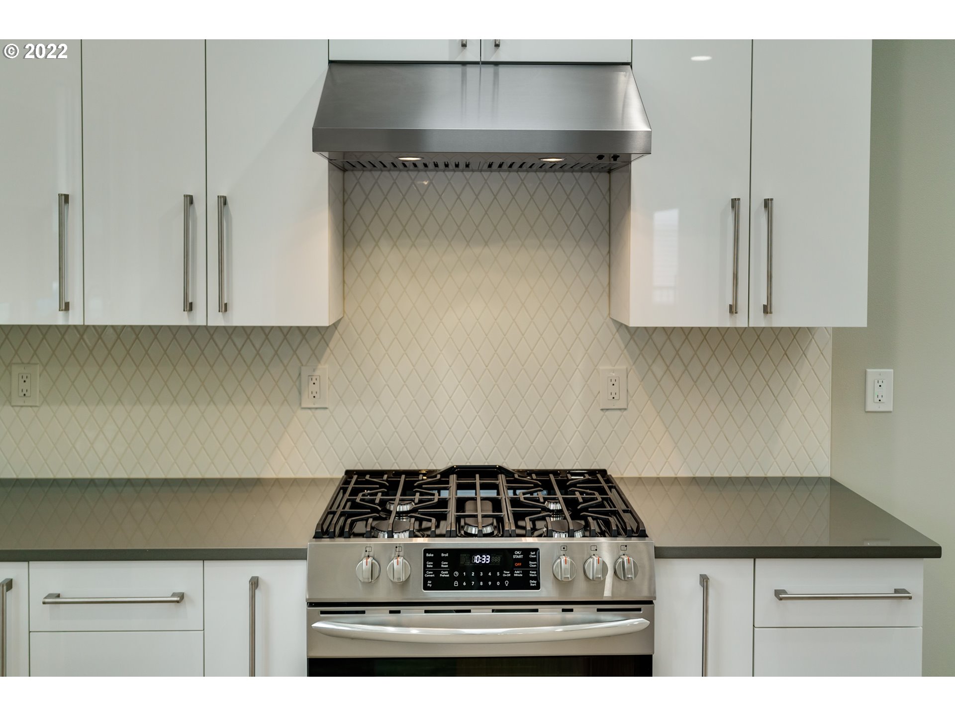 7975 Southwest Oleson Road Portland, OR 97223 - Photo 13 of 32 a stove top oven sitting inside of a kitchen
