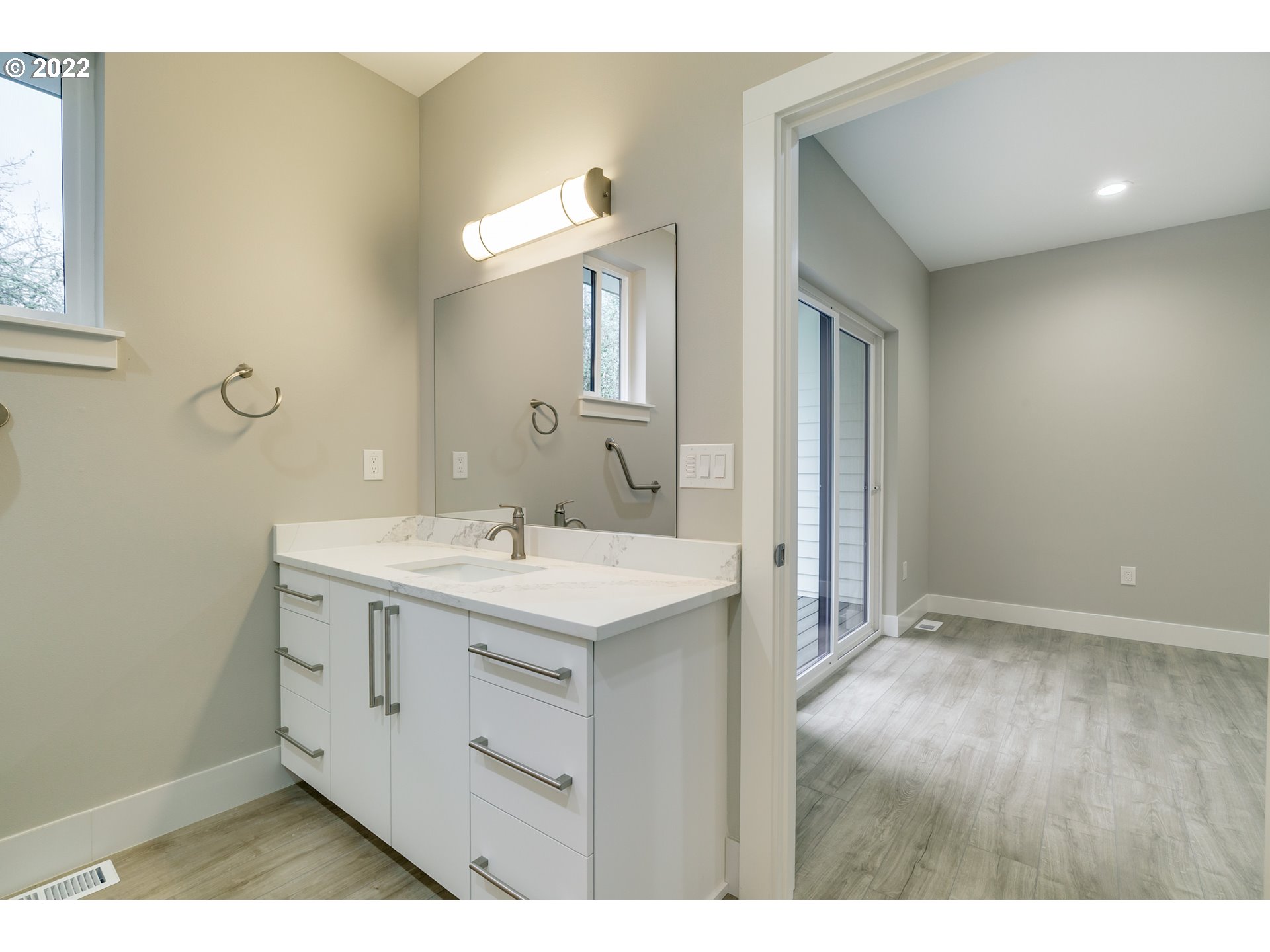 7975 Southwest Oleson Road Portland, OR 97223 - Photo 26 of 32 a bathroom with a sink a mirror and a vanity