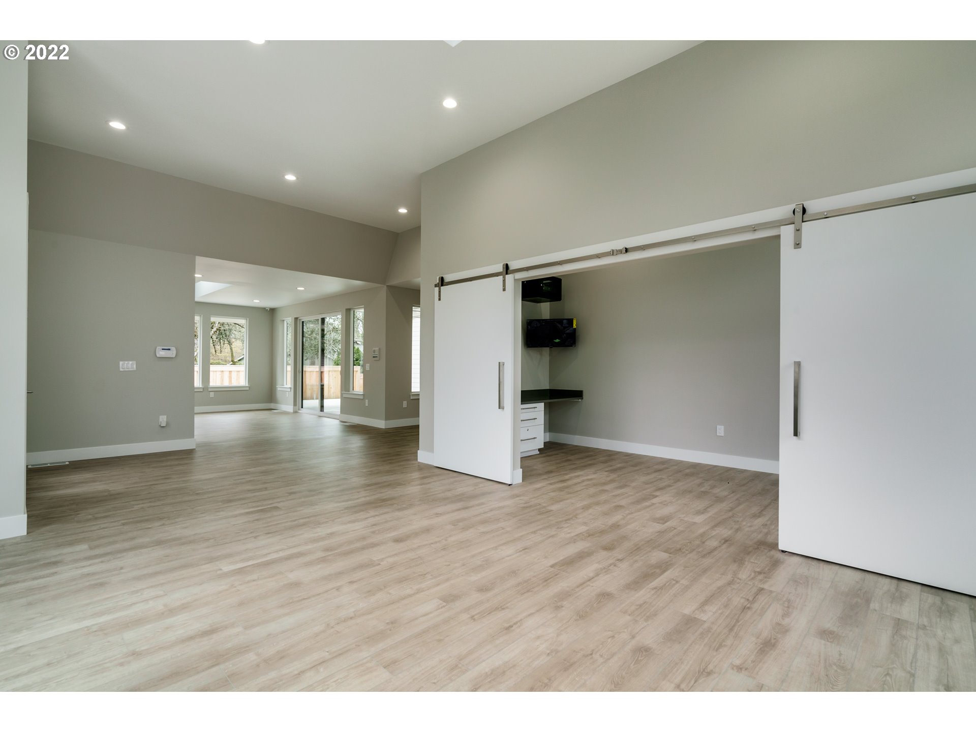 7975 Southwest Oleson Road Portland, OR 97223 - Photo 7 of 32 a view of an empty room with wooden floor