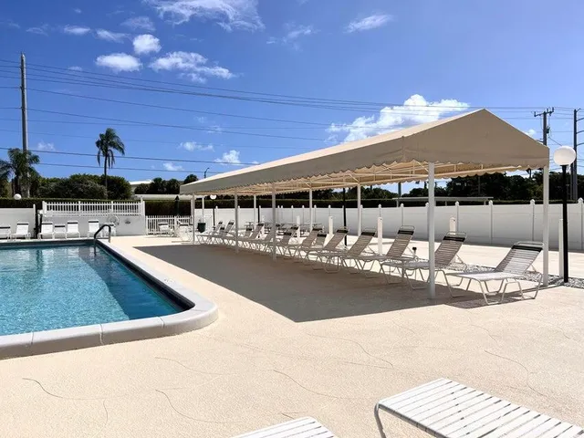 a view of a swimming pool with a patio