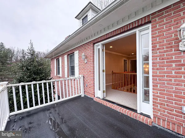 a large kitchen with stainless steel appliances kitchen island granite countertop a sink and cabinets