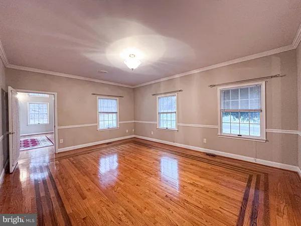 a view of an empty room with a fireplace