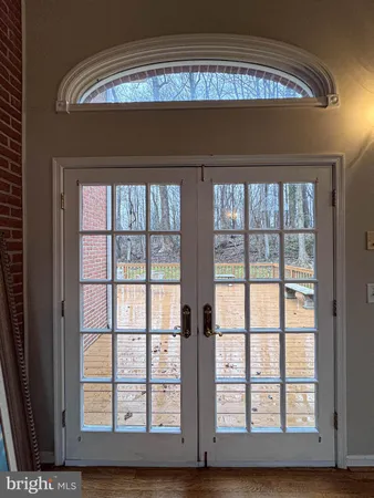 a large bathroom with a granite countertop double vanity sink and a mirror