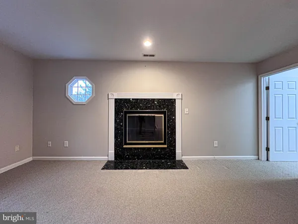 a close up of a sink and mirror in a bathroom