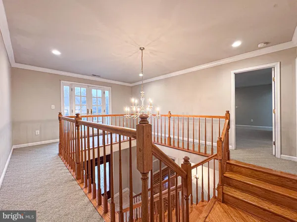 a view of a hallway with seating area