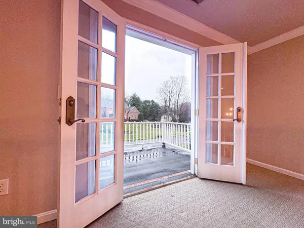 a view of a porch with wooden floor and fence