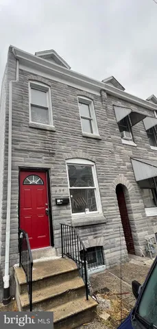 a front view of a house with stairs