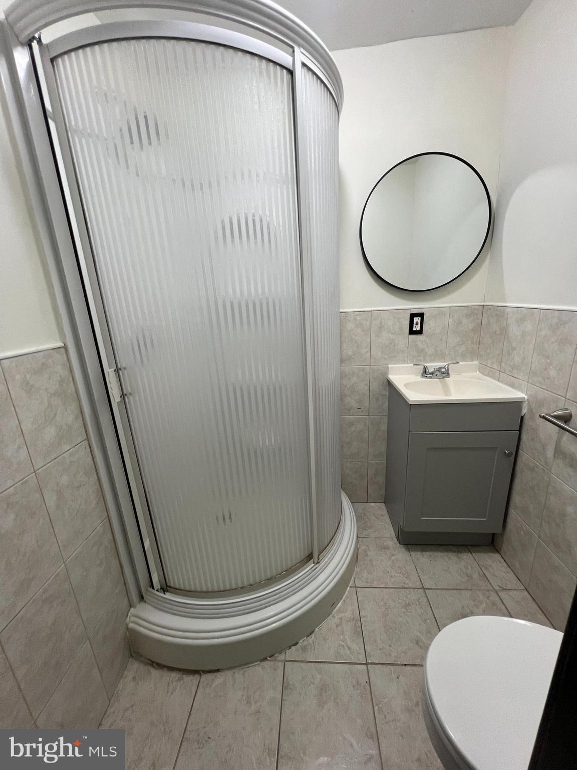434 Birch Street Reading, PA 19604 - Photo 13 of 21 a bathroom with a sink a mirror and vanity