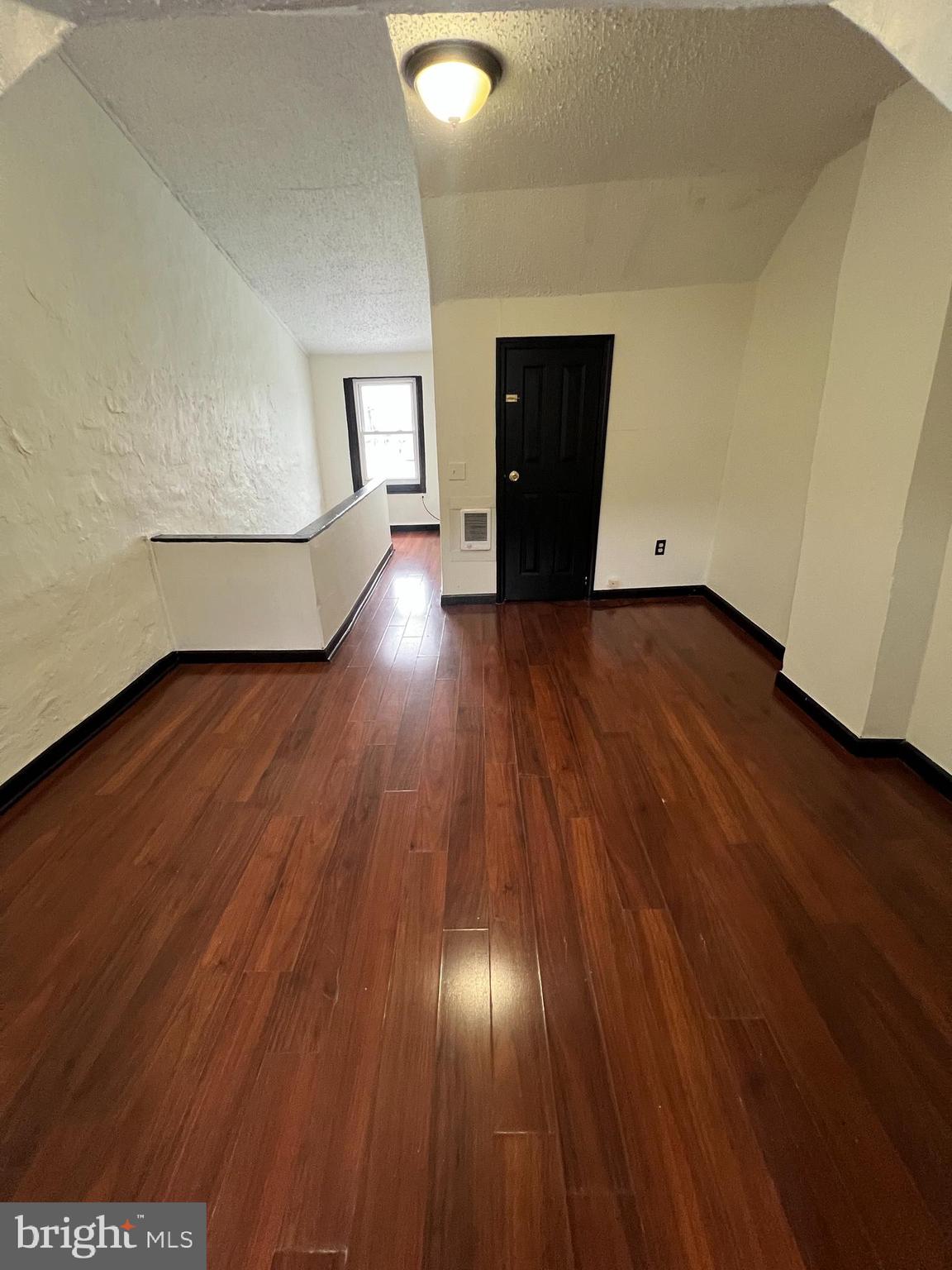 434 Birch Street Reading, PA 19604 - Photo 20 of 21 a view of empty room with wooden floor