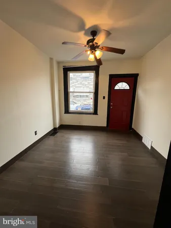 a view of an empty room with a window