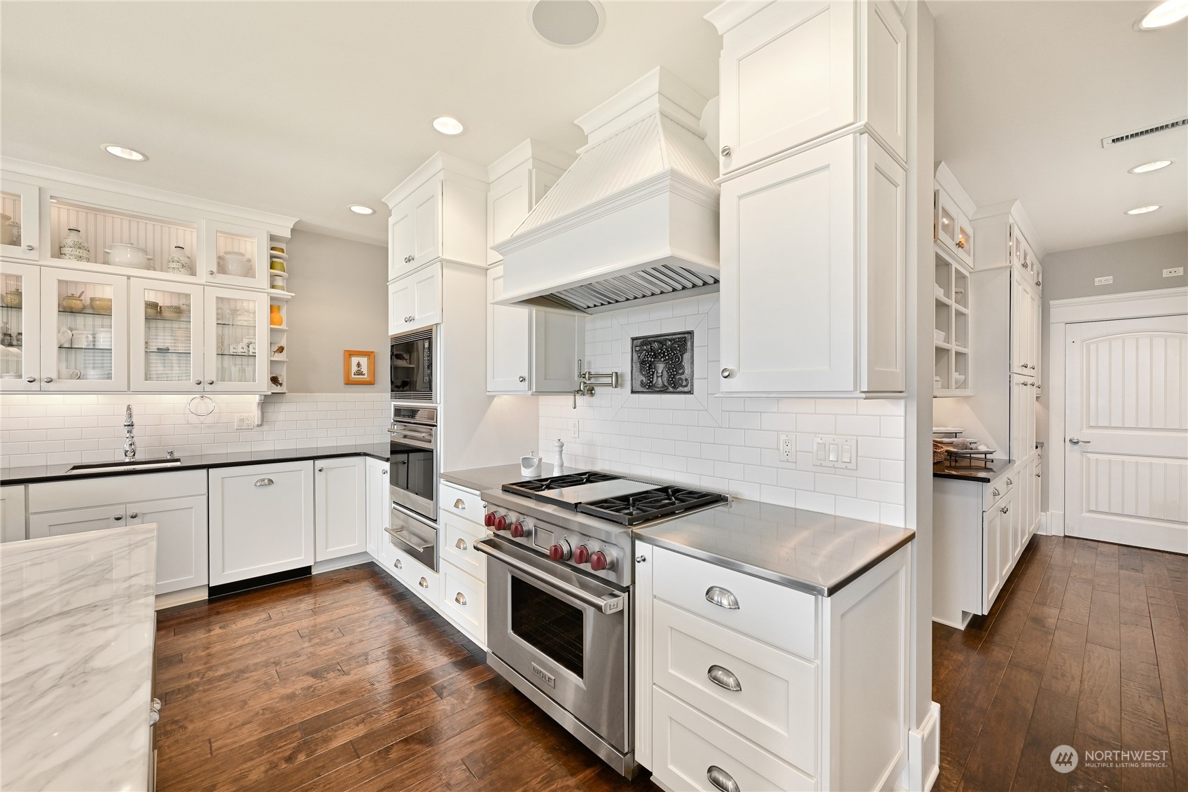 2015 Eldridge Avenue Bellingham, WA 98225 - Photo 17 of 40 a kitchen with stainless steel appliances granite countertop a stove and a sink