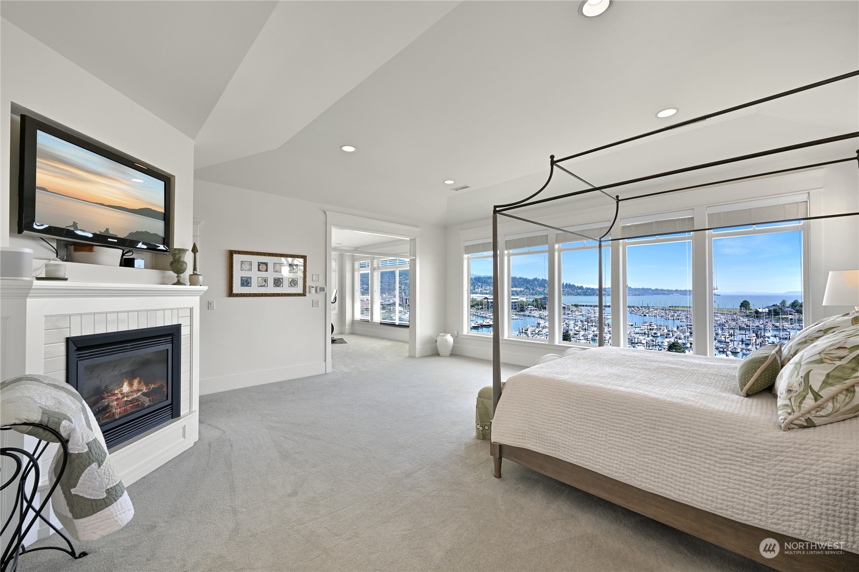 2015 Eldridge Avenue Bellingham, WA 98225 - Photo 22 of 40 a spacious bedroom with a bed and a flat screen tv