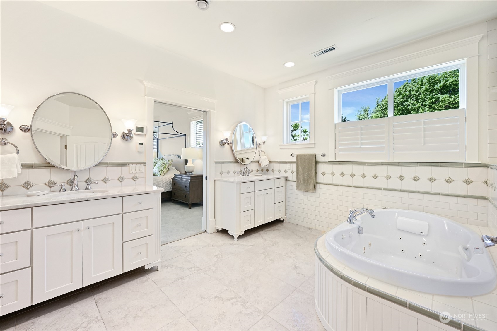2015 Eldridge Avenue Bellingham, WA 98225 - Photo 23 of 40 a spacious bathroom with a double vanity sink and a mirror